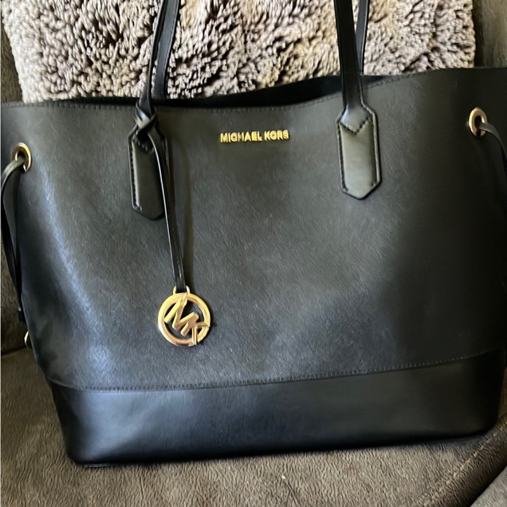 Michael Kors black tote W/gold embellishments. Matching wallet